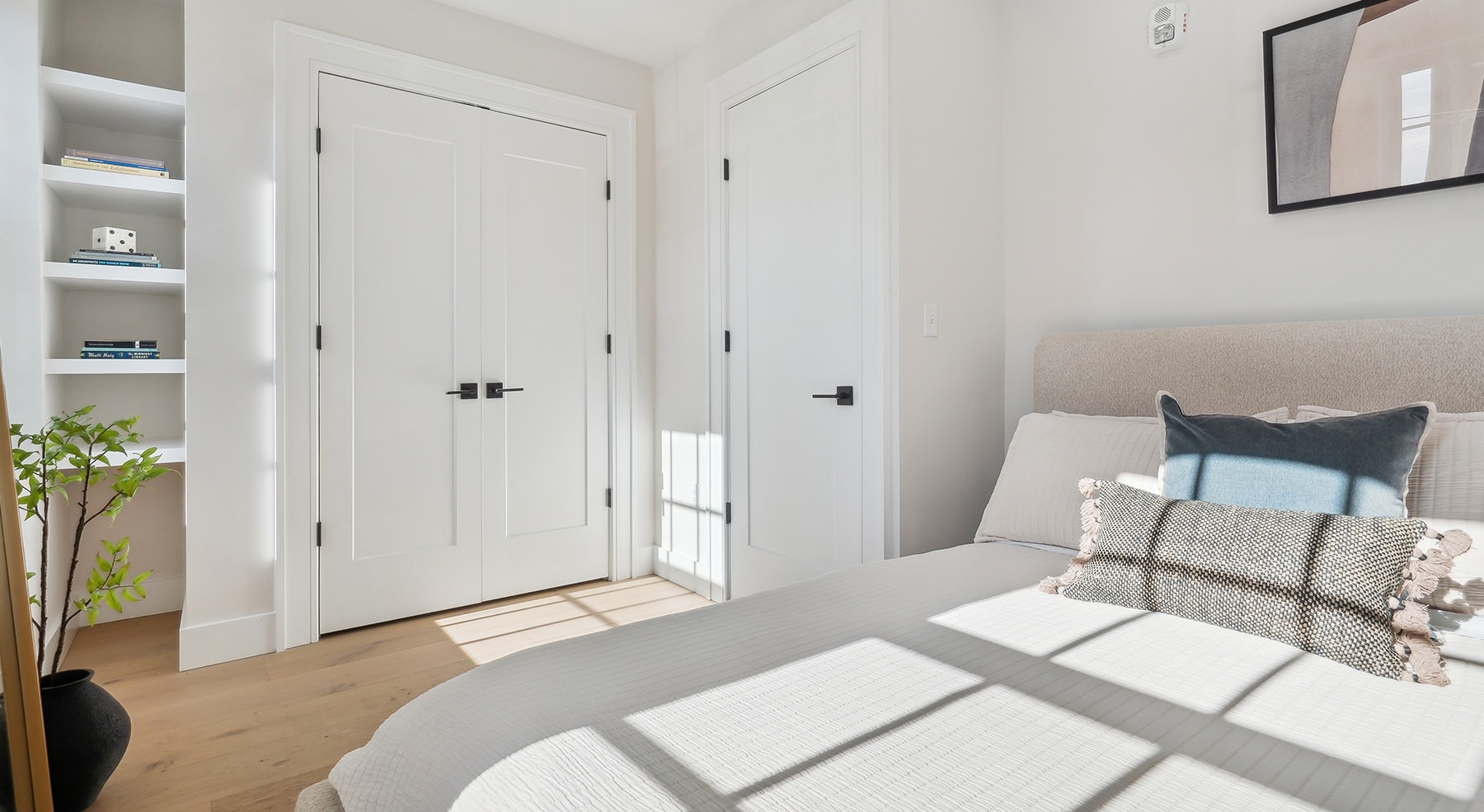 large bed with pillow on it